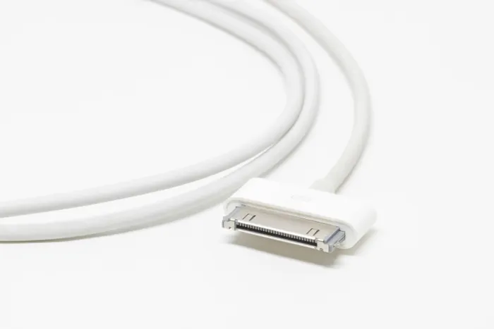 Close view of a white charging cable connector
