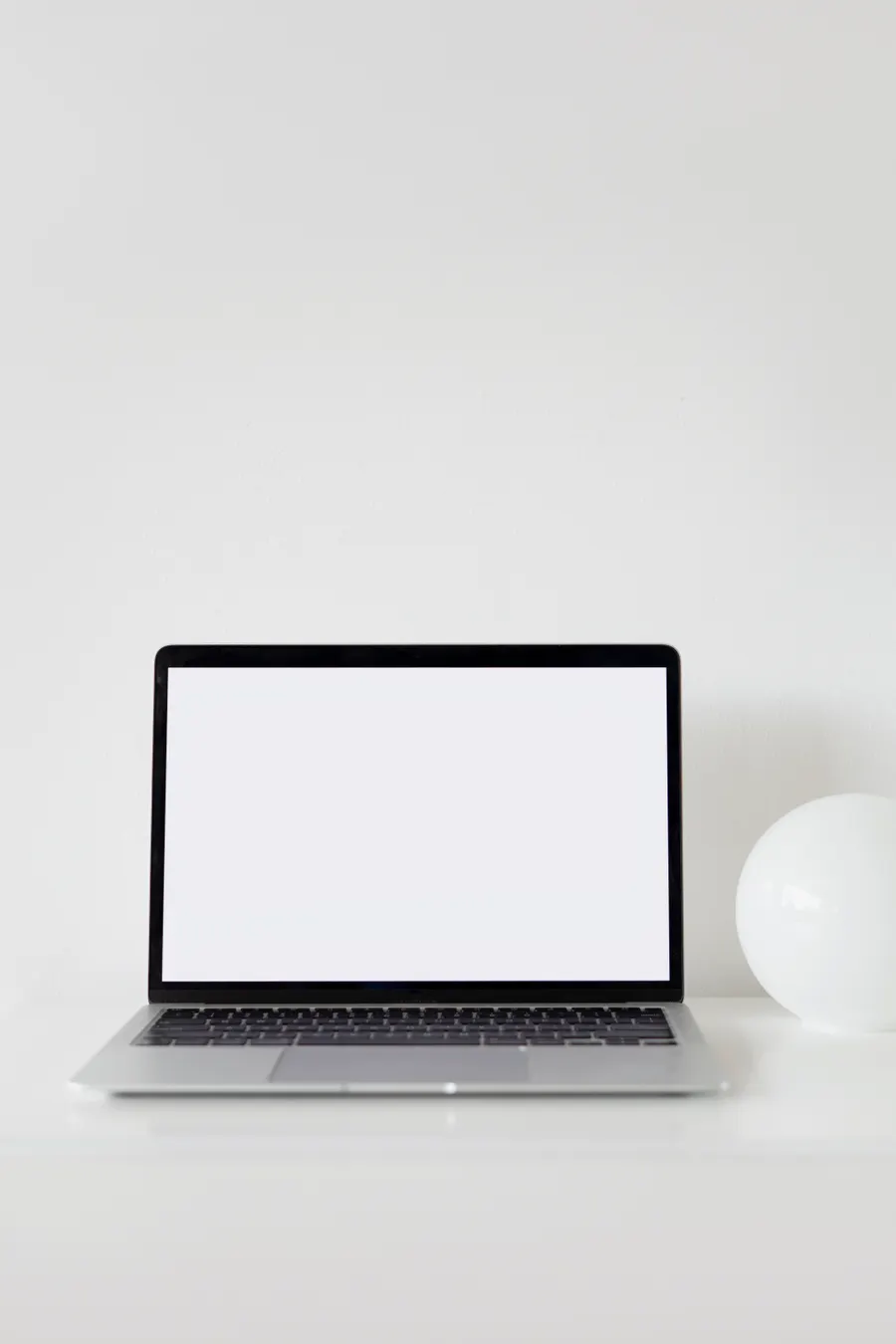 Open laptop on a pale background