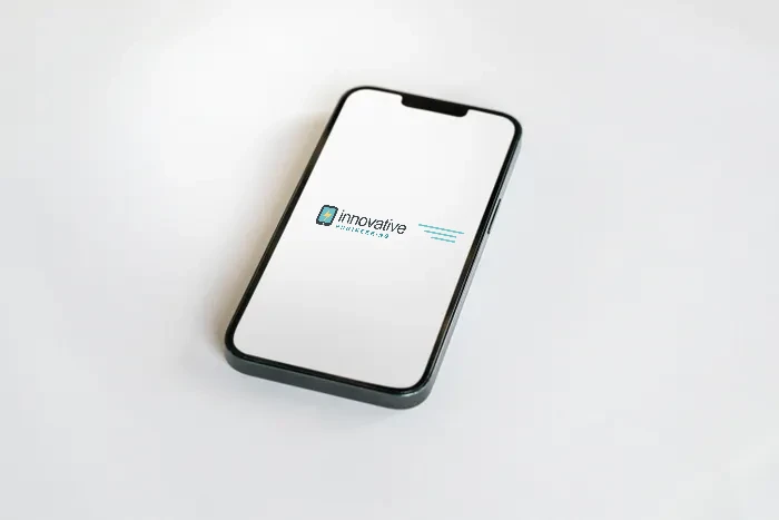 Illustrative stock composite of a phone showing the Innovative Engineering wordmark